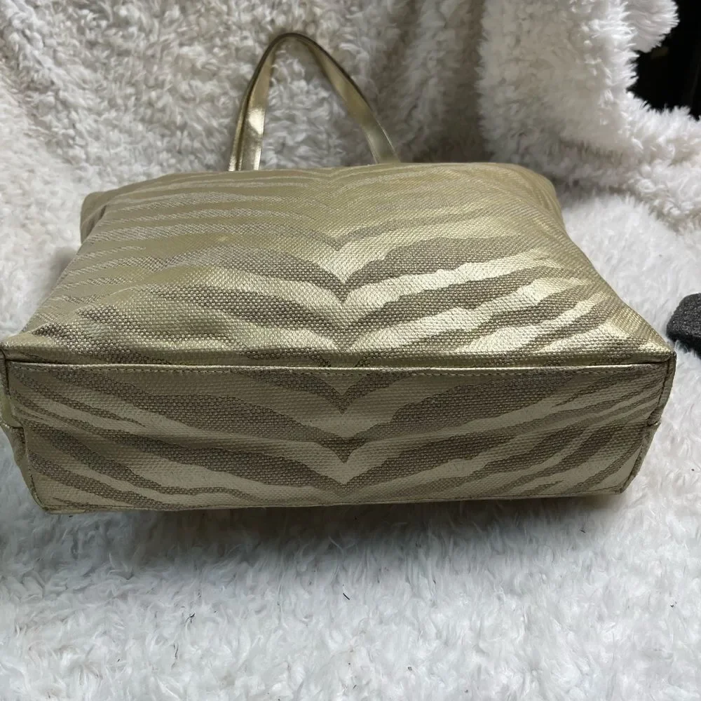 Michael Kors Metallic gold zebra print large tote gold tone hardwares and straps
